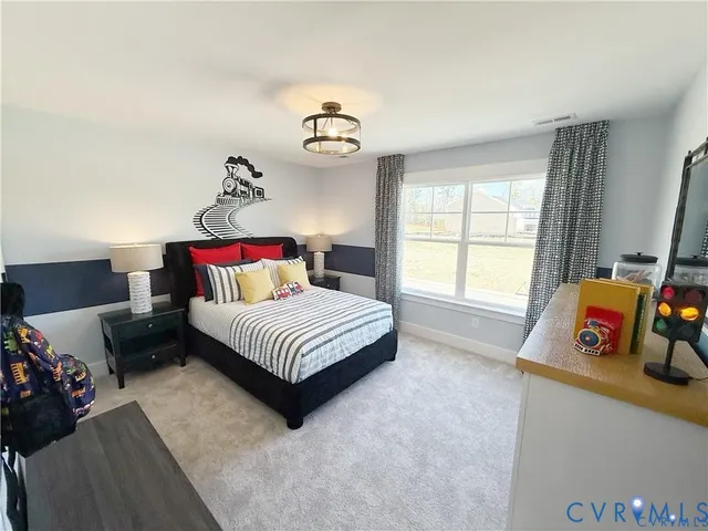 a bedroom with furniture and a window