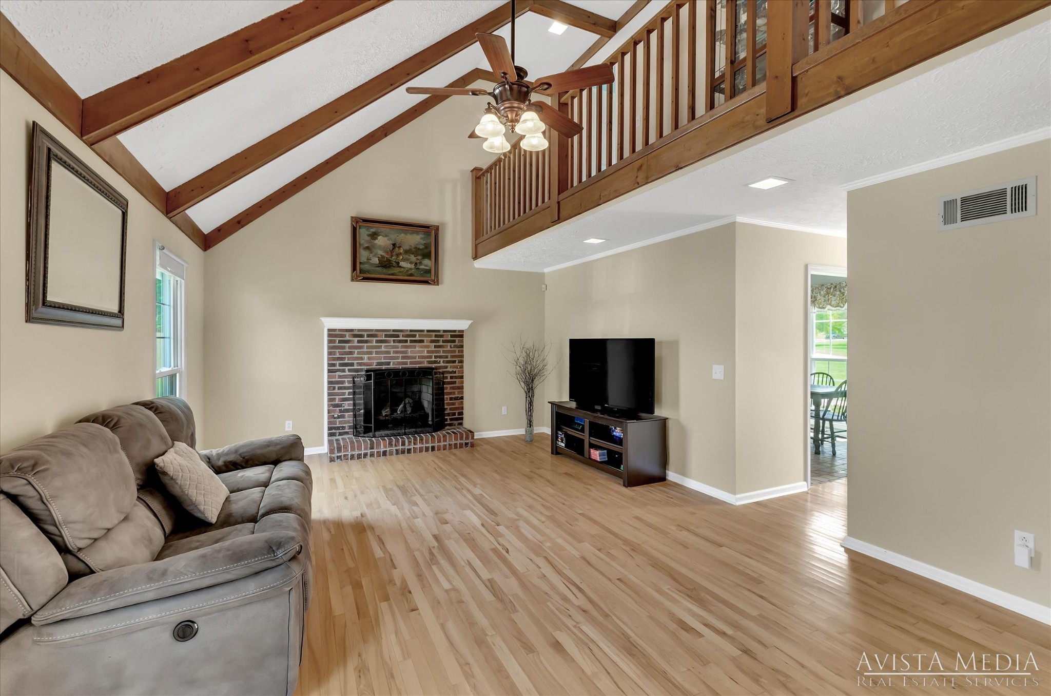 6348 Gum Station Road Springfield, TN 37172 - Photo 4 of 19 a living room with furniture a flat screen tv and a fireplace