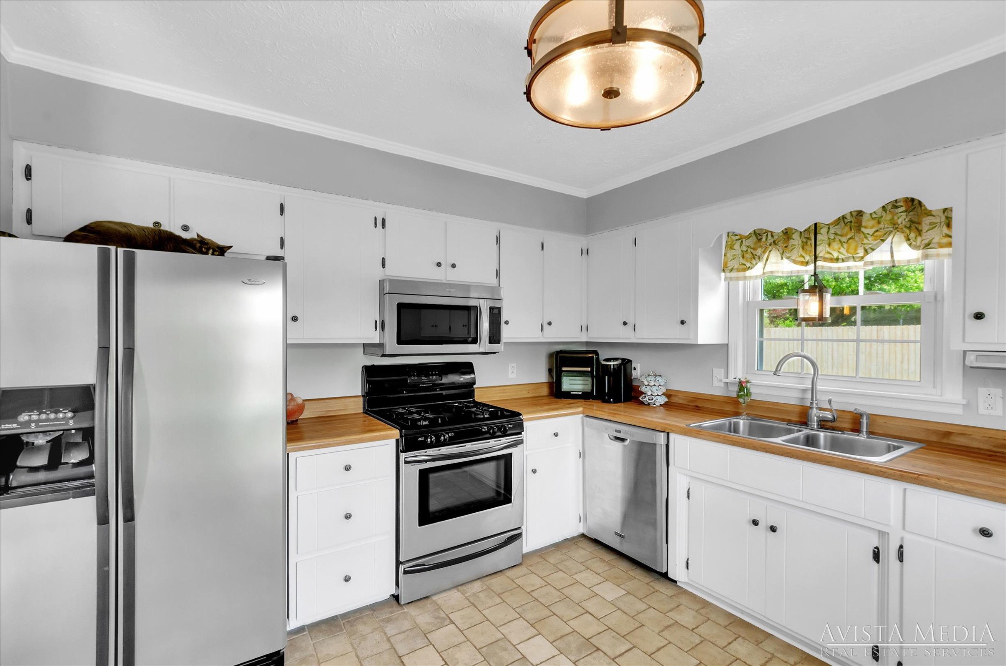 6348 Gum Station Road Springfield, TN 37172 - Photo 5 of 19 a kitchen with stainless steel appliances a white cabinets and a stove