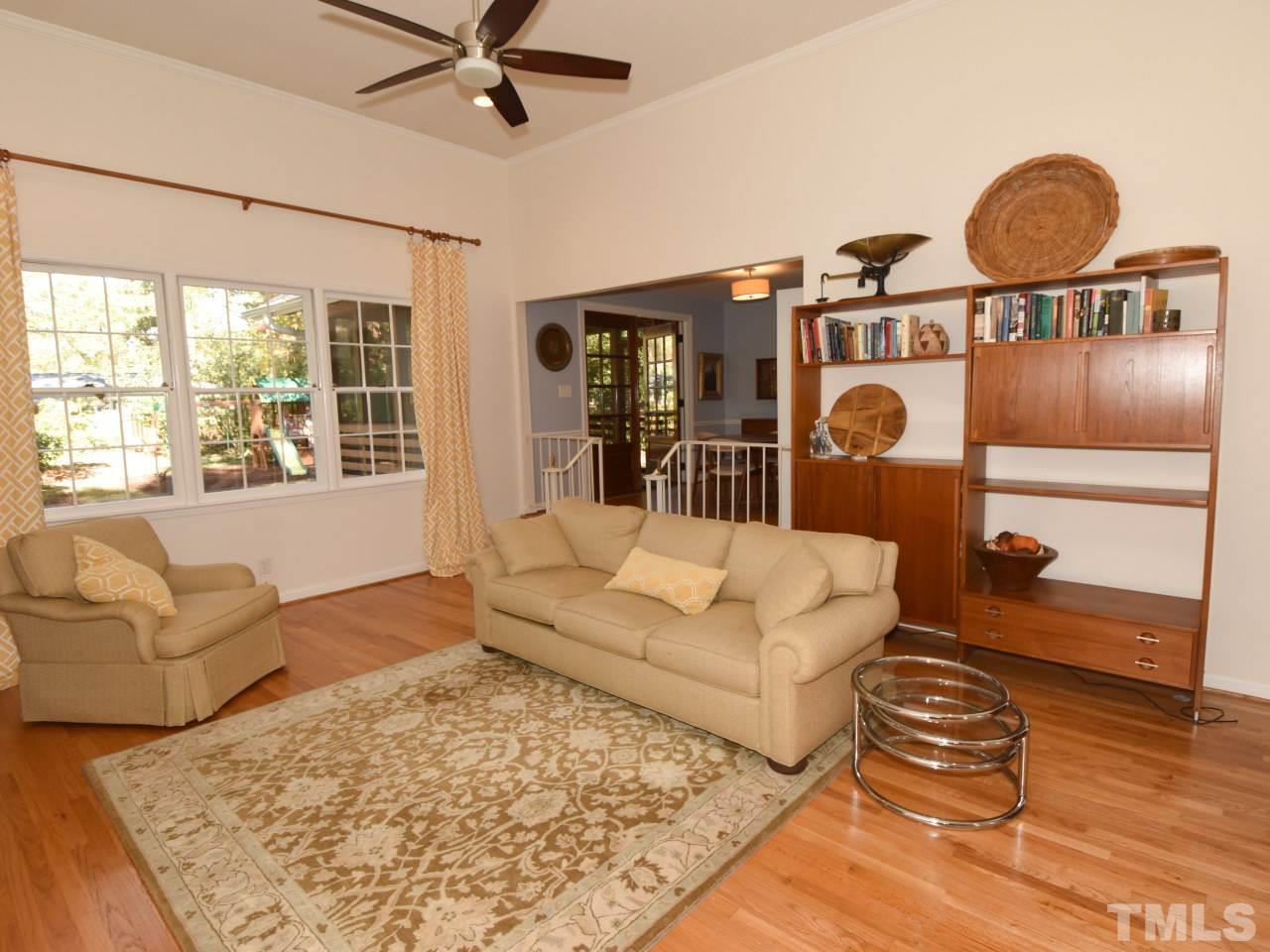 616 Macon Place Raleigh, NC 27609 - Photo 2 of 25 a living room with furniture and a large window