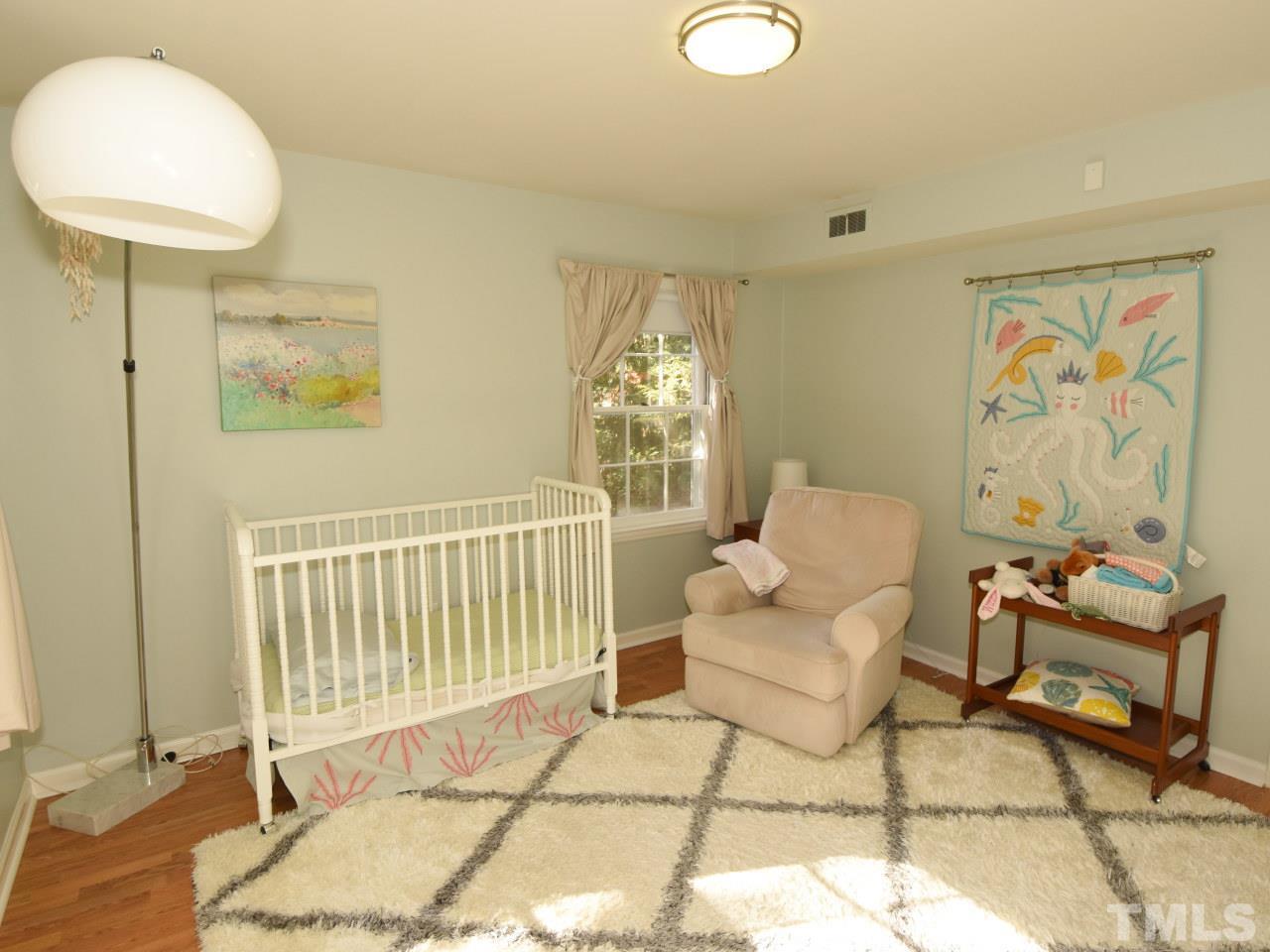 616 Macon Place Raleigh, NC 27609 - Photo 17 of 25 a living room with furniture and a window