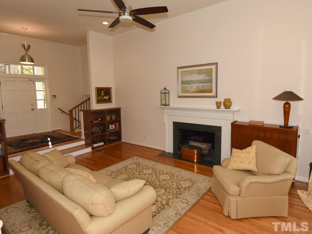 616 Macon Place Raleigh, NC 27609 - Photo 3 of 25 a living room with furniture and a fireplace