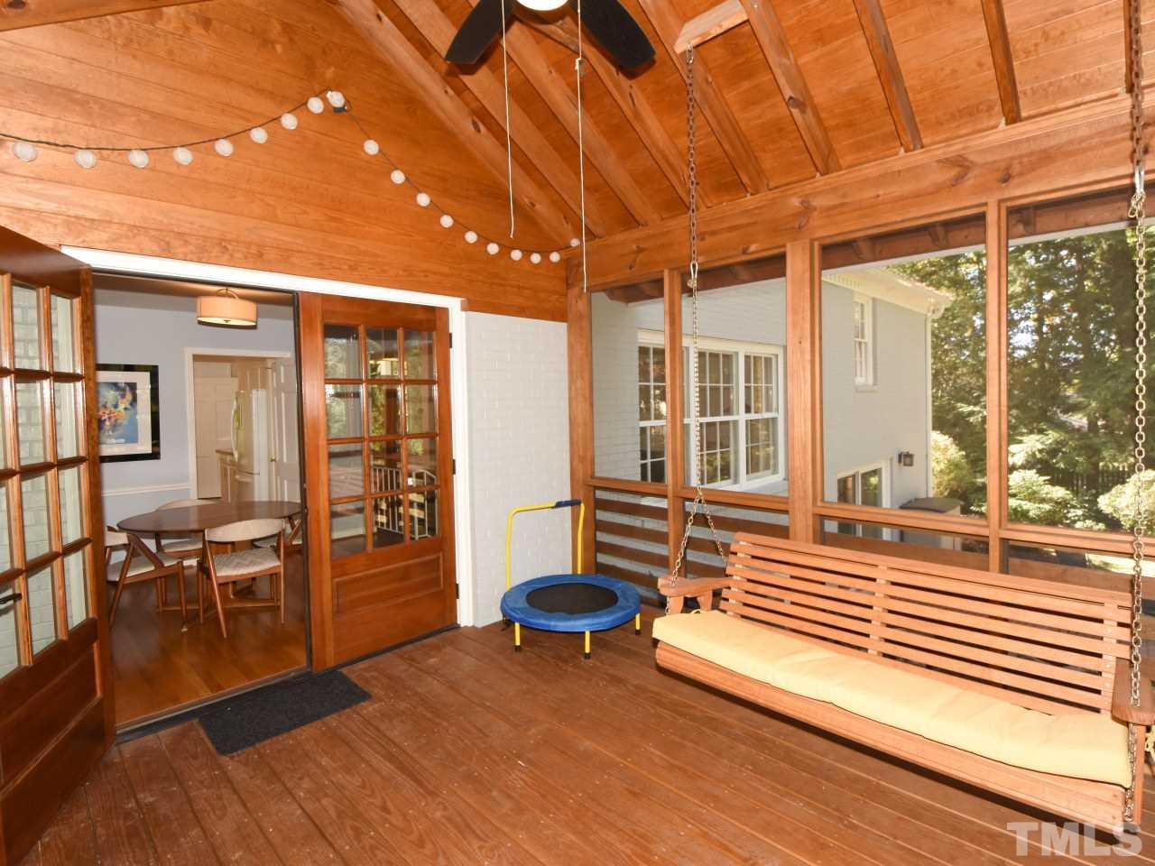 616 Macon Place Raleigh, NC 27609 - Photo 21 of 25 a view of a porch with furniture and a yard