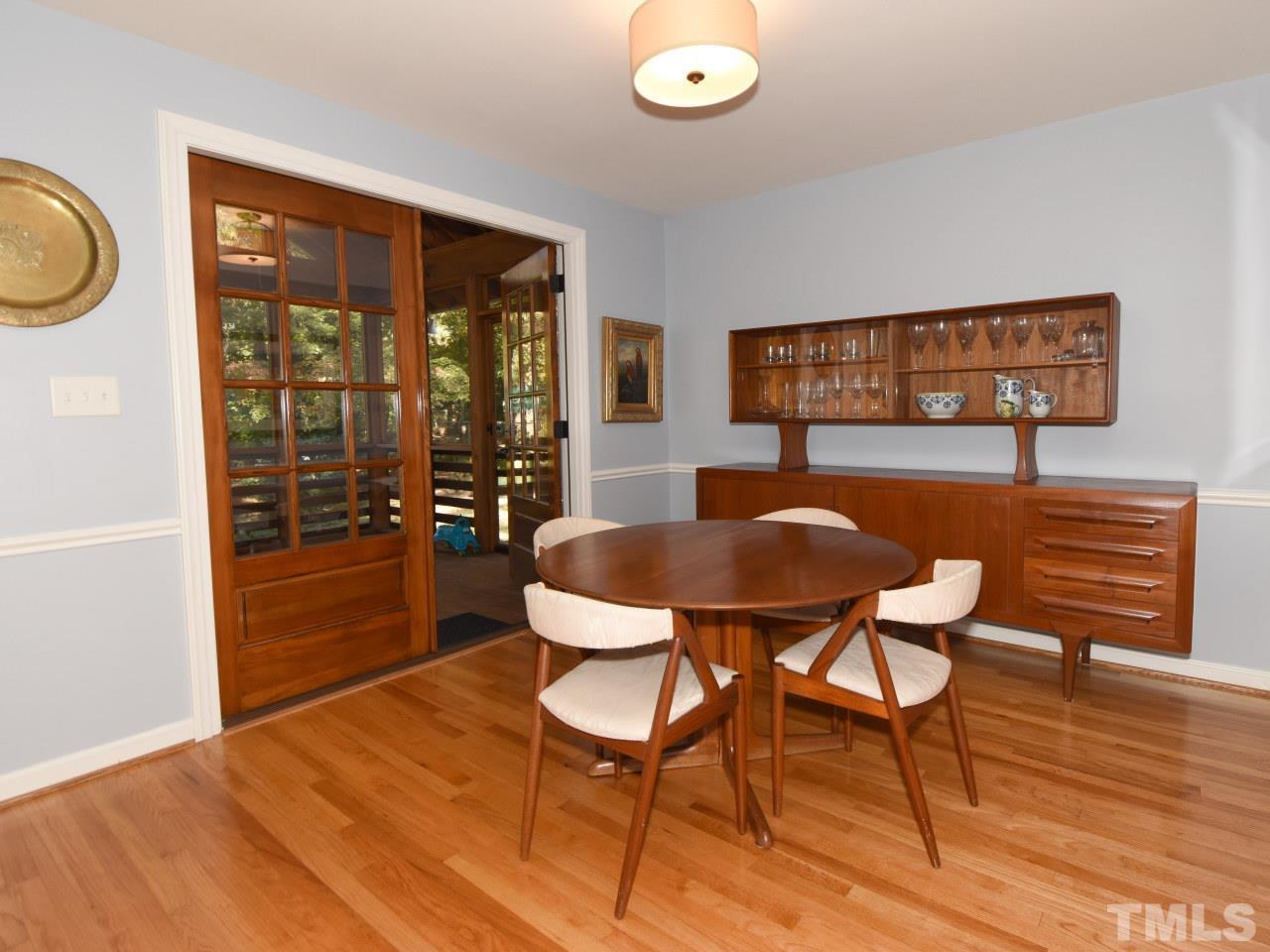 616 Macon Place Raleigh, NC 27609 - Photo 4 of 25 a view of a dining room with furniture and wooden floor