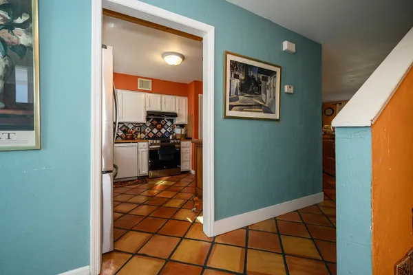 a kitchen with stainless steel appliances a refrigerator and a stove top oven