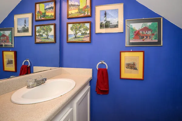 a view of a bedroom with window and cabinet