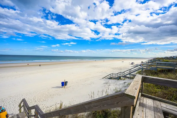 a sign that is sitting in front of a house