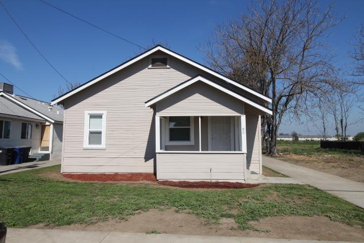 90 Magnolia Avenue Lemoore, CA 93245 - Photo 1 of 17 a front view of a house with a yard