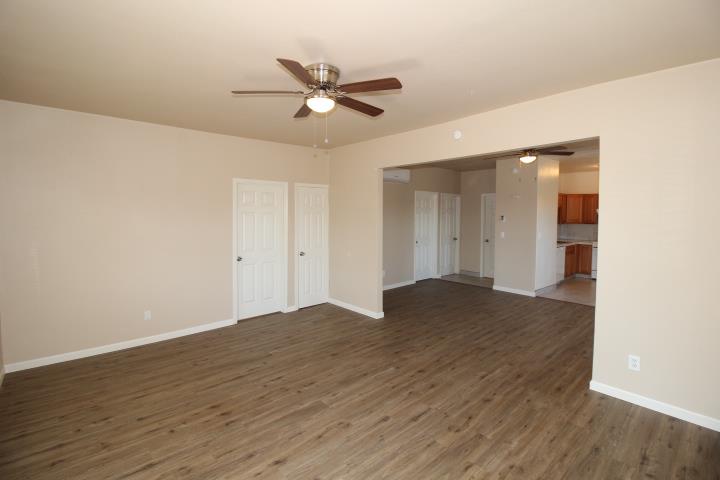 90 Magnolia Avenue Lemoore, CA 93245 - Photo 3 of 17 a view of a livingroom with a ceiling fan