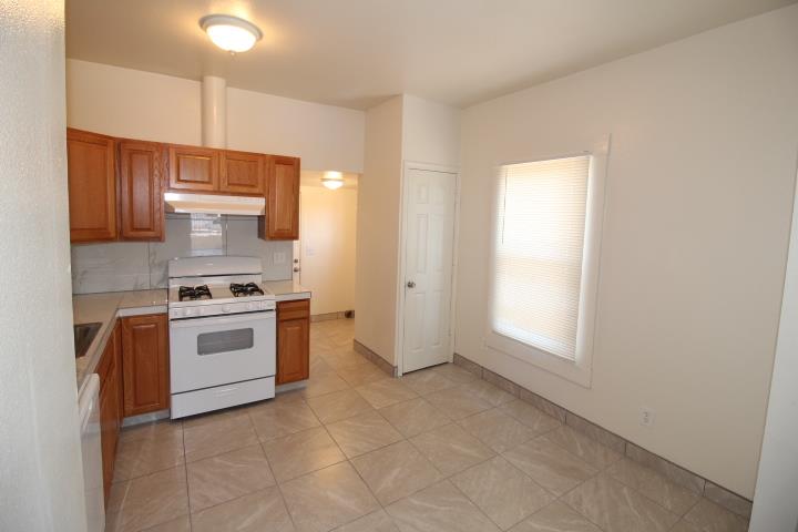 90 Magnolia Avenue Lemoore, CA 93245 - Photo 9 of 17 a kitchen with a stove and a sink