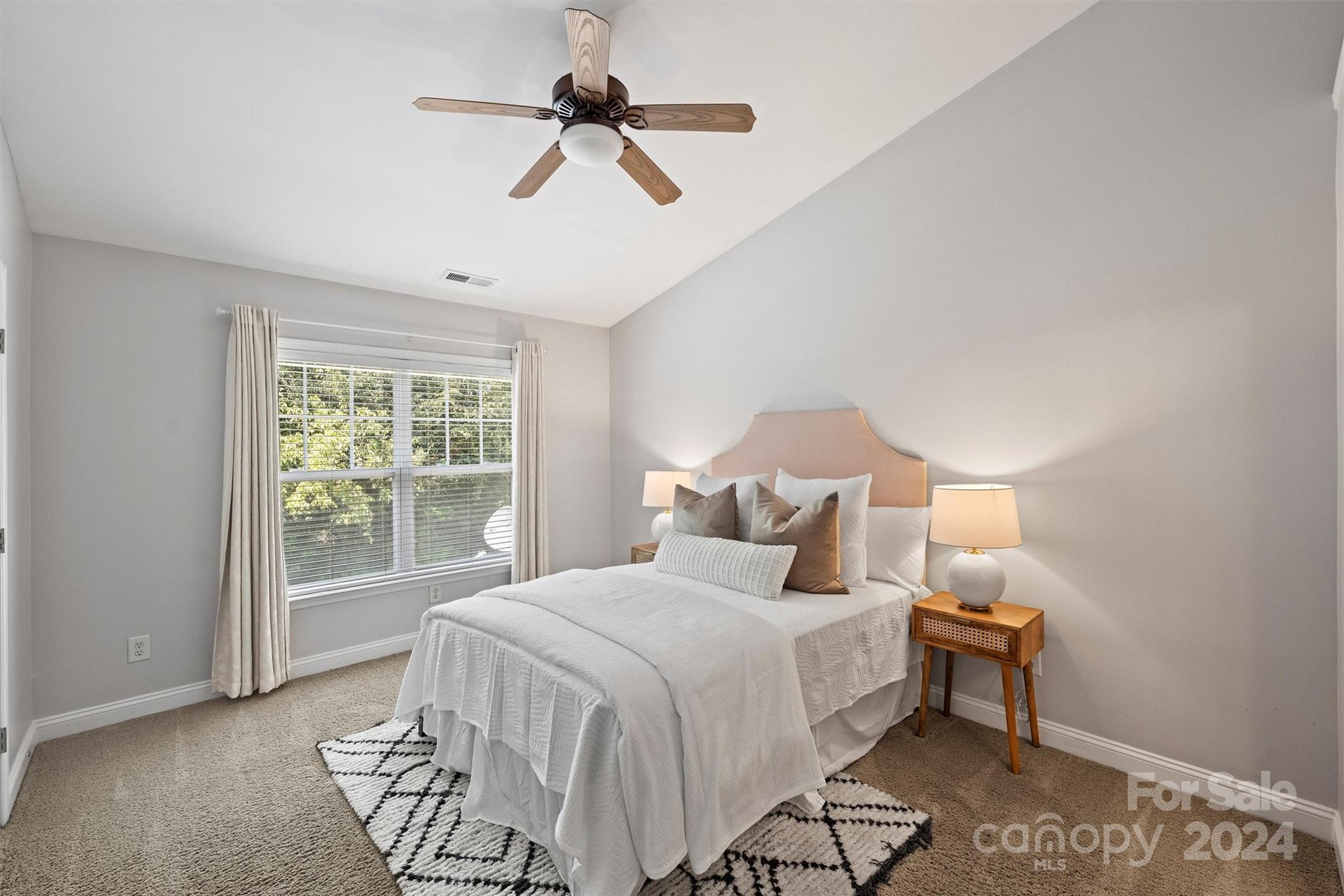 323 Hurston Circle Charlotte, NC 28208 - Photo 13 of 27 a bedroom with a bed and a large window