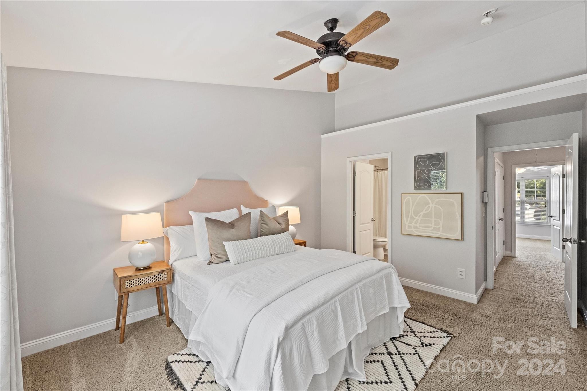 323 Hurston Circle Charlotte, NC 28208 - Photo 14 of 27 a bedroom with a bed and a chandelier