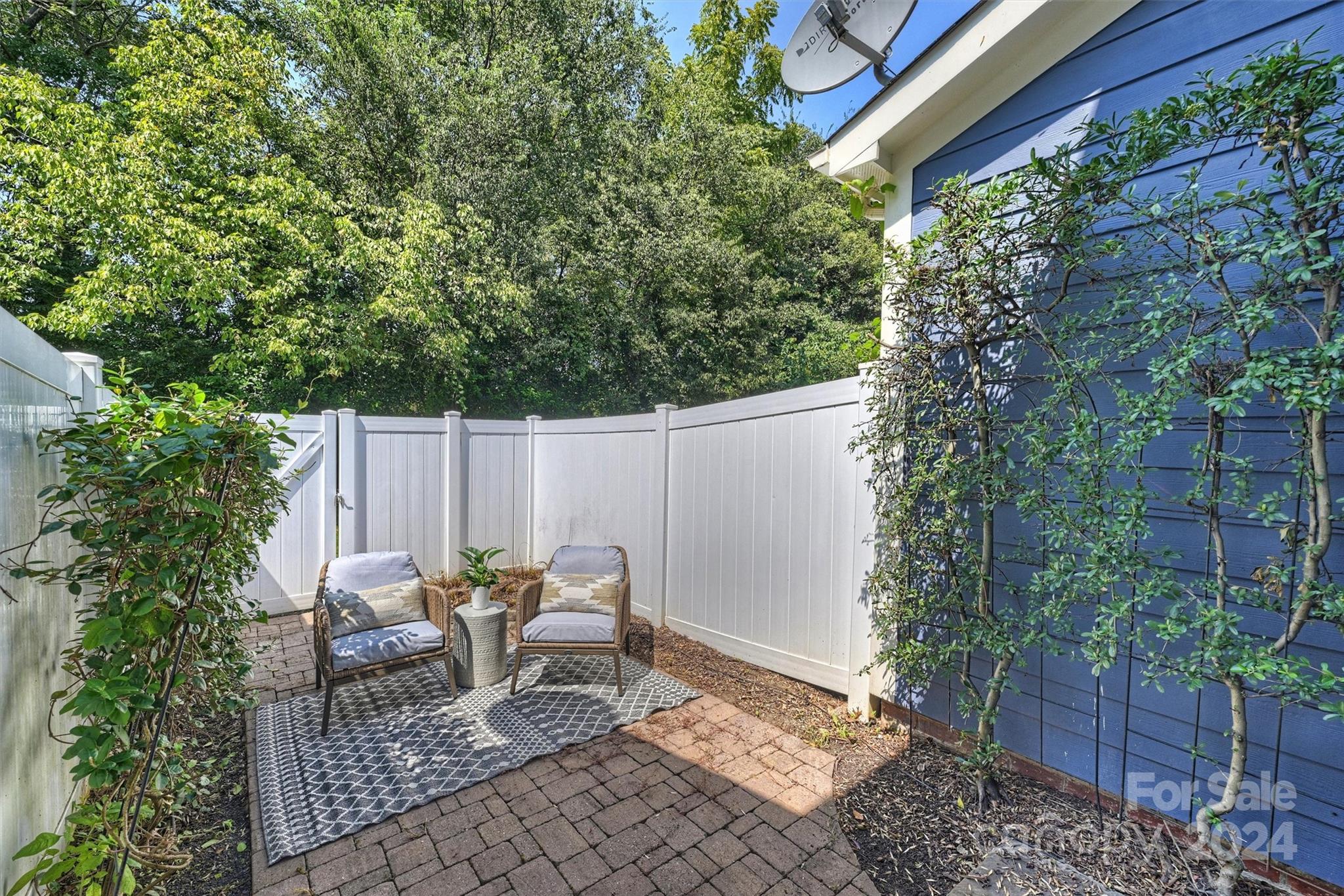 323 Hurston Circle Charlotte, NC 28208 - Photo 21 of 27 a view of a chair and table in backyard of the house