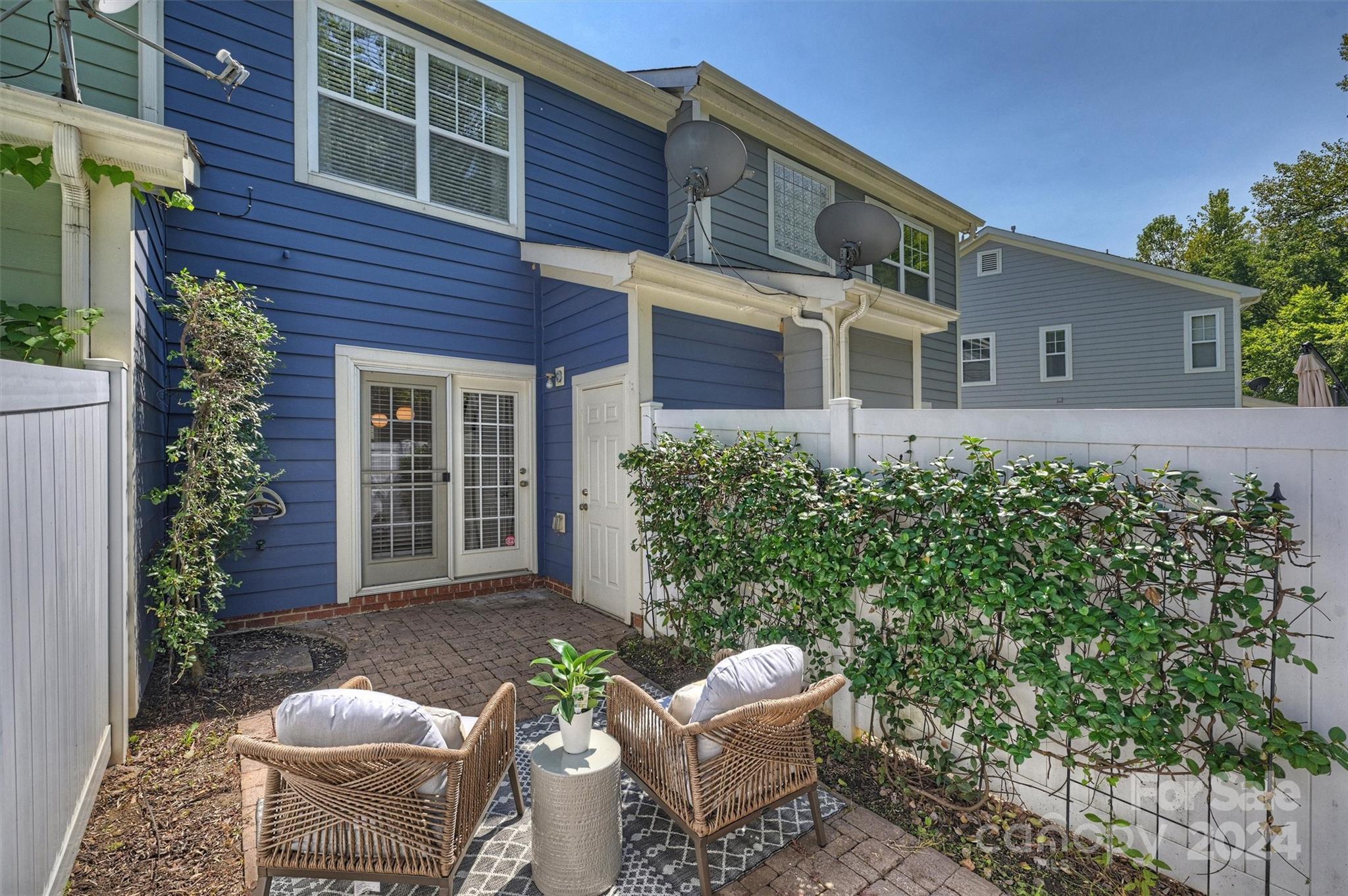 323 Hurston Circle Charlotte, NC 28208 - Photo 23 of 27 a view of a house with a chairs in a patio