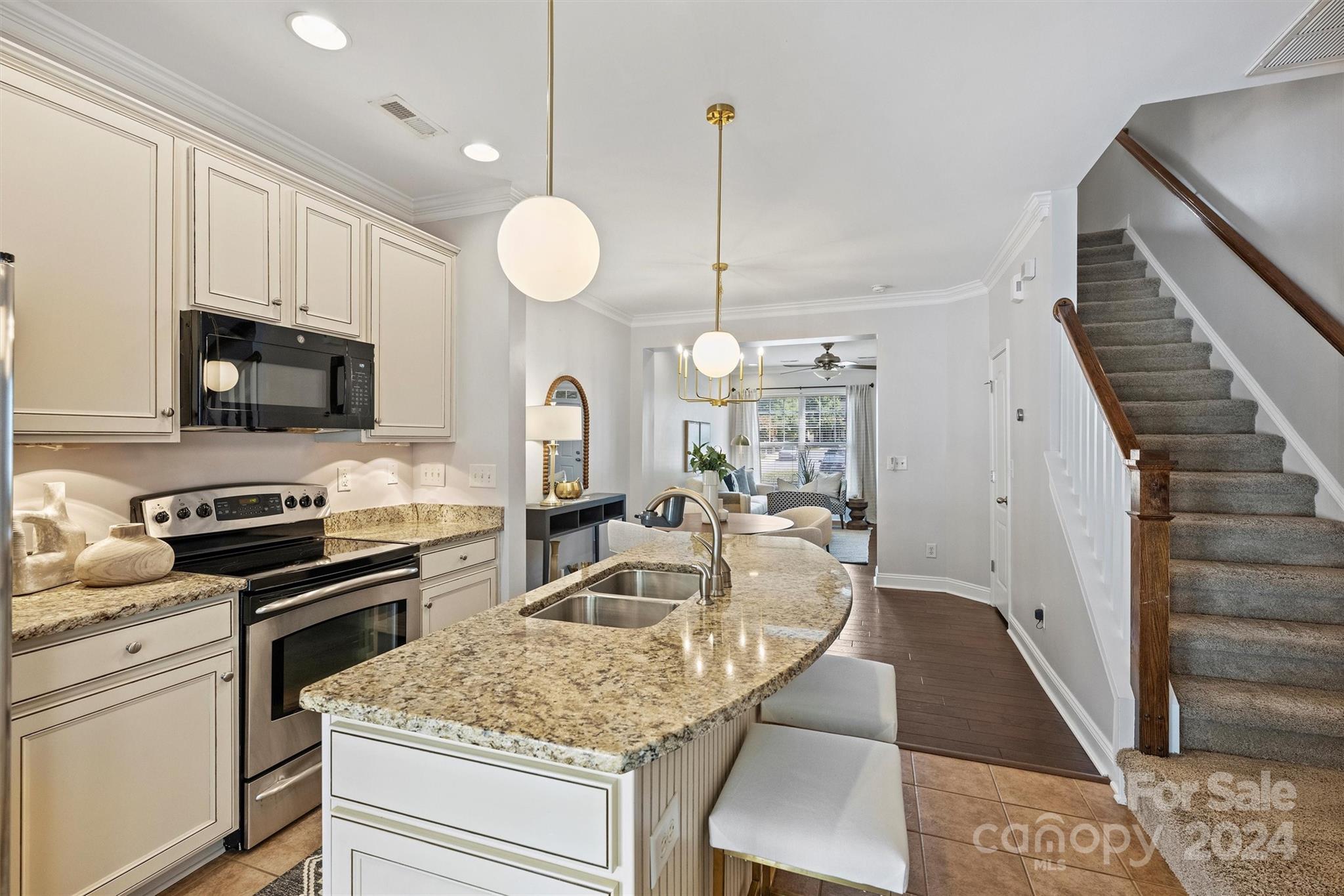 323 Hurston Circle Charlotte, NC 28208 - Photo 9 of 27 a kitchen with a sink a counter space appliances and cabinets