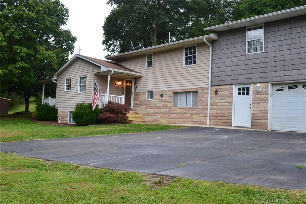 138 Mowl Road Washington, PA 15301 - Photo 2 of 43 a front view of a house with garden