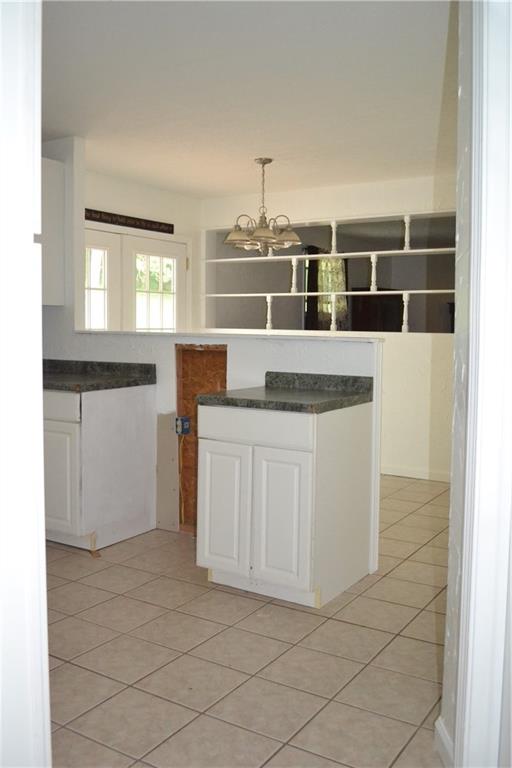 138 Mowl Road Washington, PA 15301 - Photo 31 of 43 a kitchen with granite countertop white cabinets and white appliances