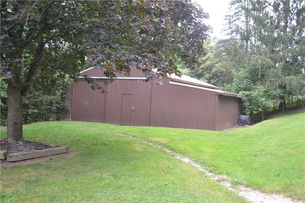 138 Mowl Road Washington, PA 15301 - Photo 43 of 43 a backyard of a house with plants and large trees
