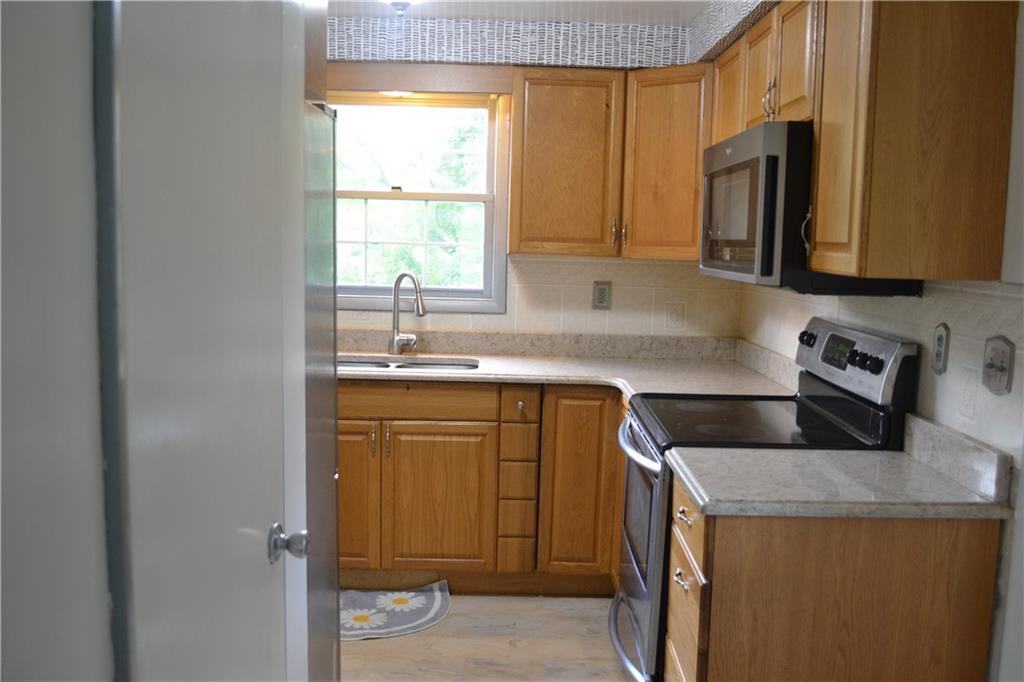 138 Mowl Road Washington, PA 15301 - Photo 6 of 43 a kitchen with stainless steel appliances granite countertop a sink stove and refrigerator