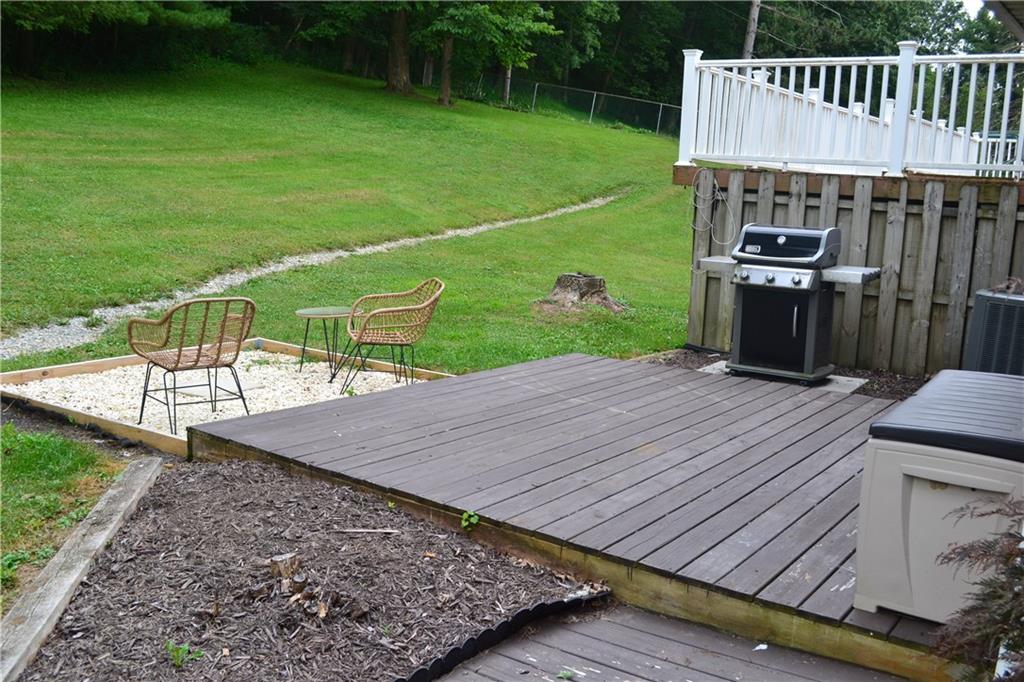 138 Mowl Road Washington, PA 15301 - Photo 9 of 43 a view of a wooden deck and a backyard