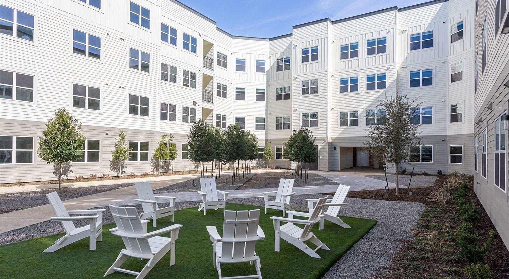 22540 Merchants Way, Unit 11115 Katy, TX 77449 - Photo 12 of 16 a view of a patio with couches table and chairs and potted plants