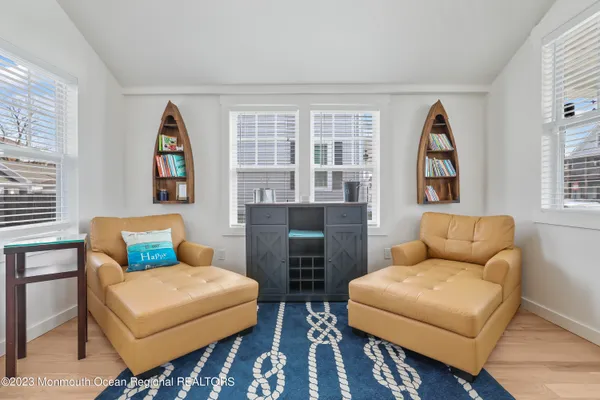 a bedroom with furniture and a chair