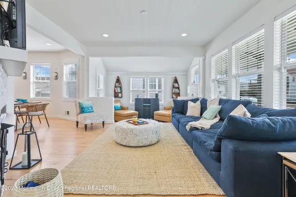 a living room with furniture and a rug
