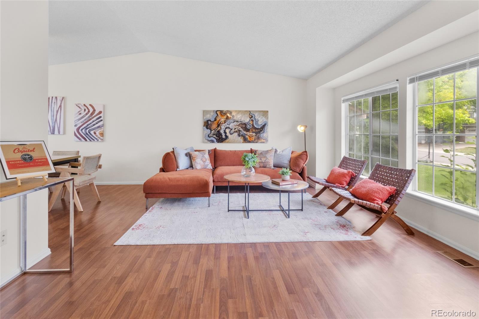 8441 Timberwood Street Highlands Ranch, CO 80126 - Photo 5 of 32 a living room with furniture and a large window