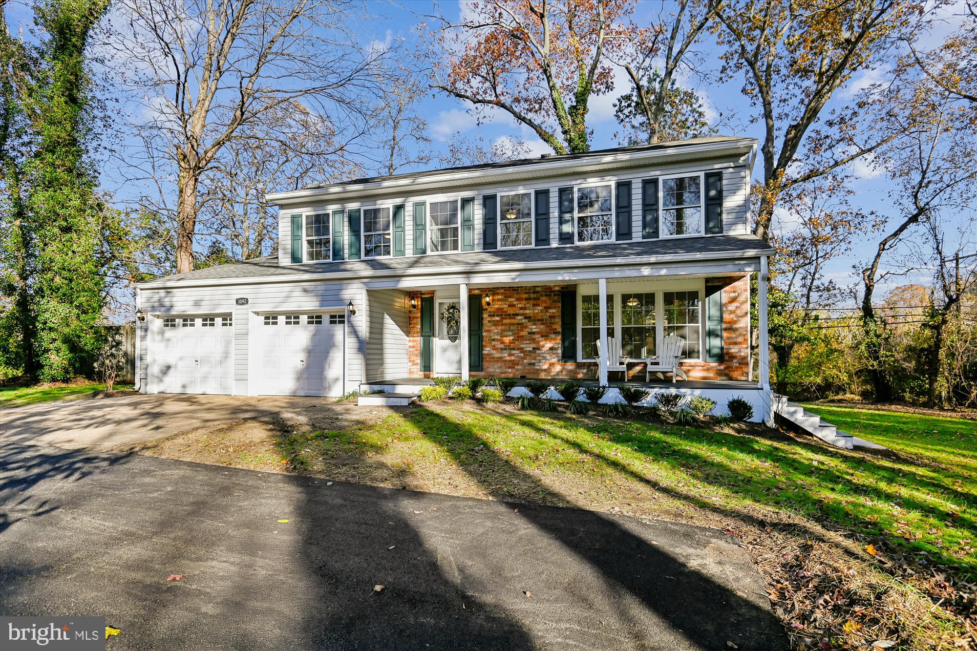 a view of a house with a yard patio and swimming pool