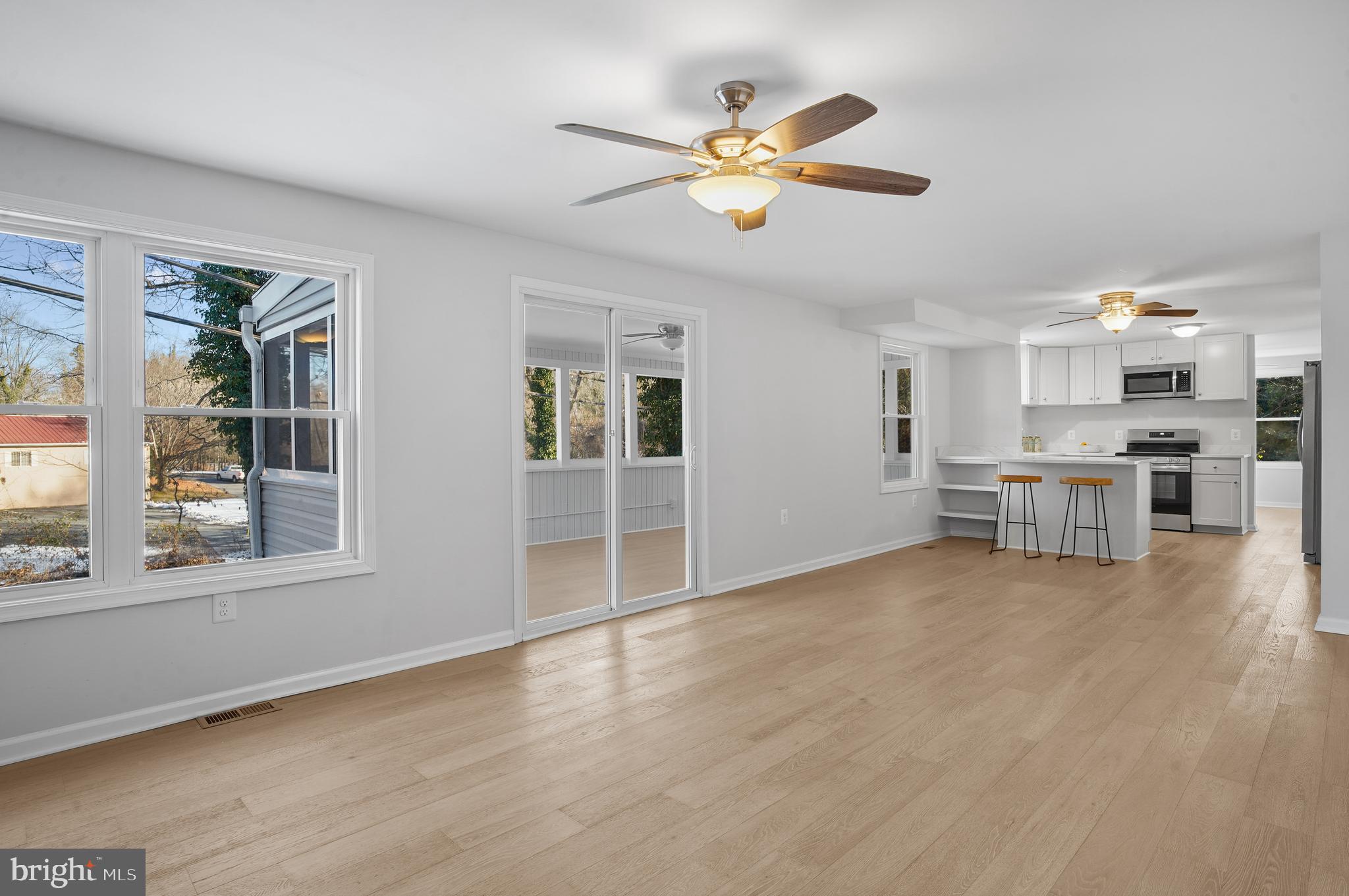 3092 Sussex Place Riva, MD 21140 - Photo 22 of 105 a view of an empty room with a window and wooden floor