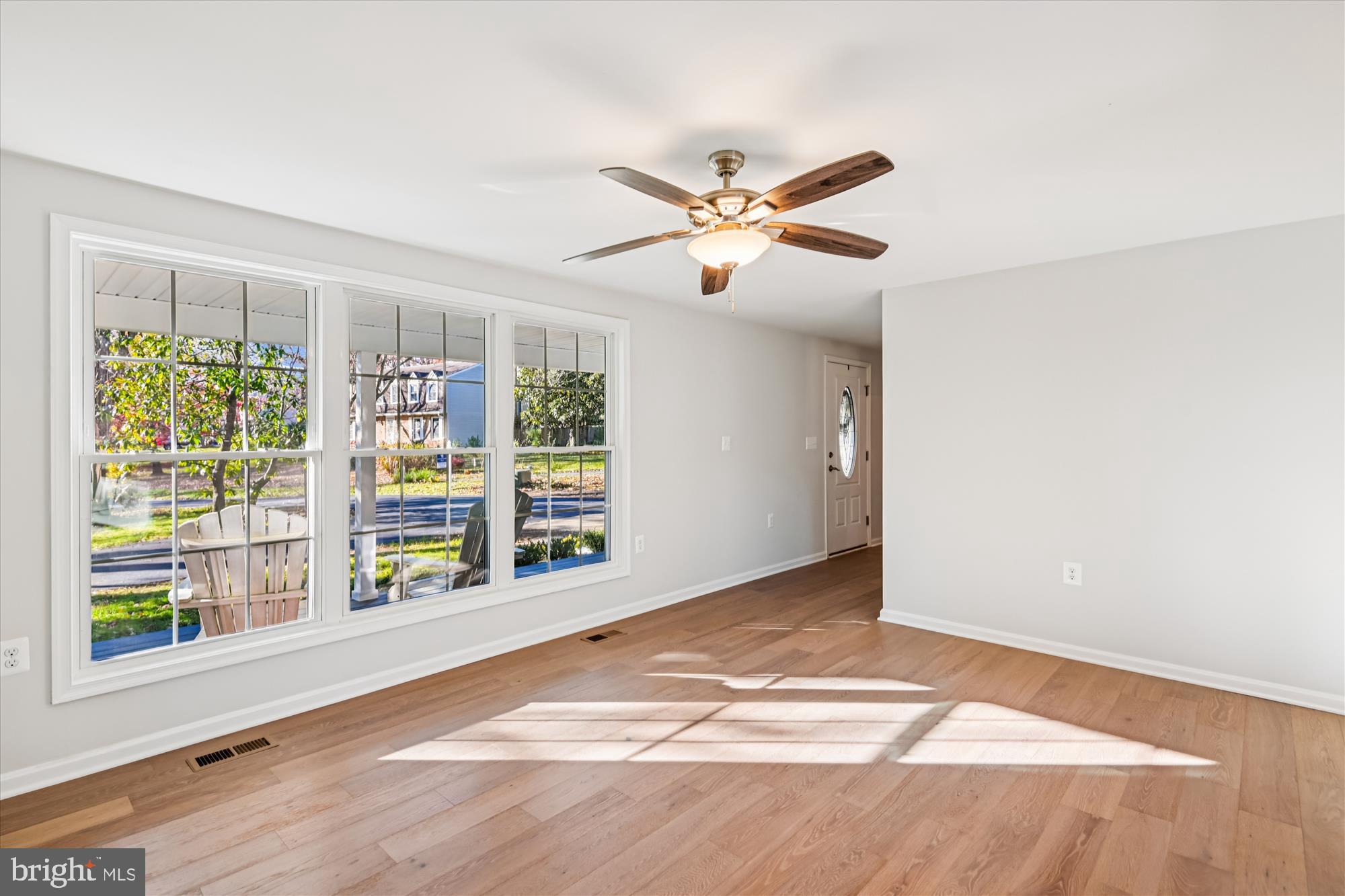 3092 Sussex Place Riva, MD 21140 - Photo 44 of 105 a view of an empty room with a window and wooden floor