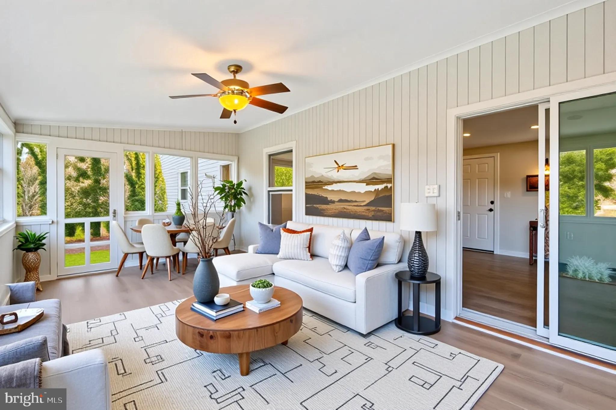 3092 Sussex Place Riva, MD 21140 - Photo 46 of 105 a living room with patio a table and a potted plant