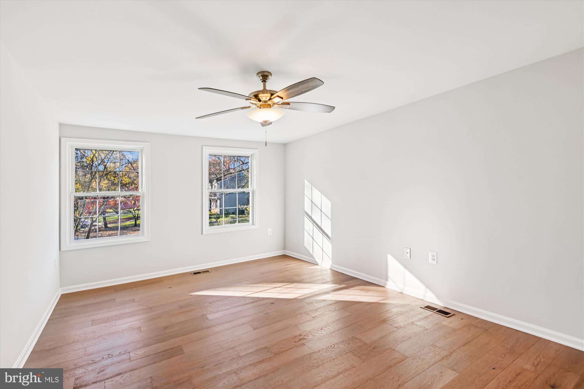 3092 Sussex Place Riva, MD 21140 - Photo 54 of 105 an empty room with wooden floor and windows