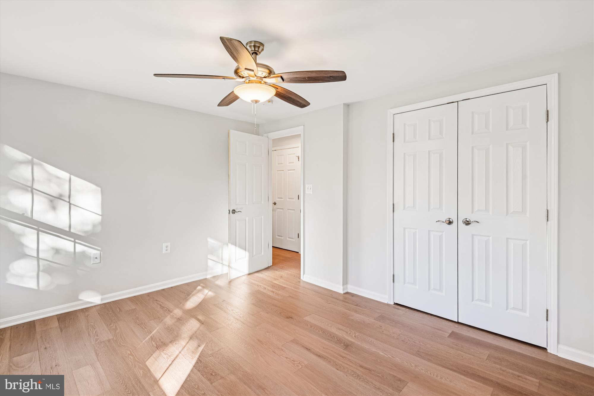 3092 Sussex Place Riva, MD 21140 - Photo 66 of 105 a view of empty room with wooden floor and fan