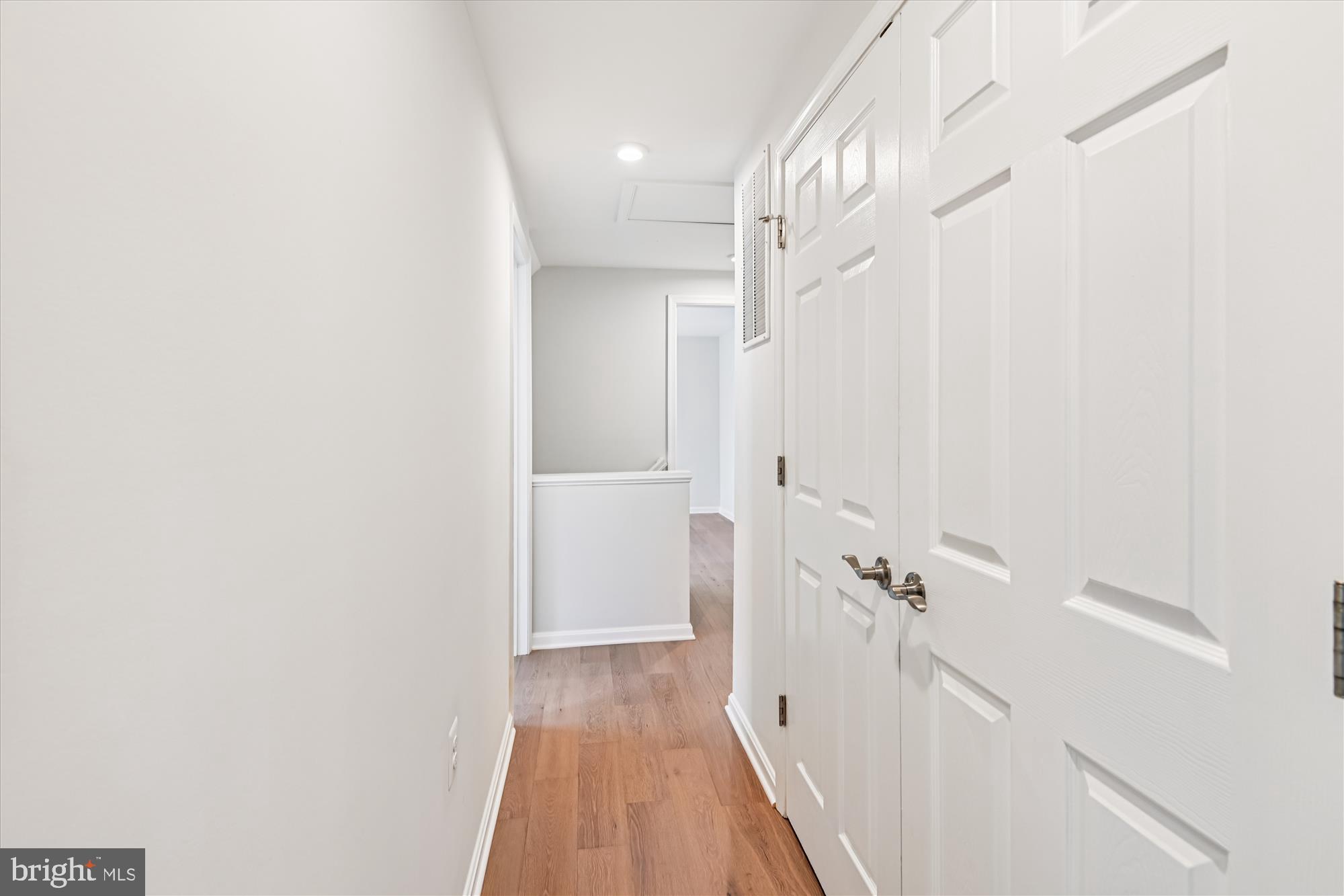 3092 Sussex Place Riva, MD 21140 - Photo 76 of 105 a view of a hallway with wooden floor and staircase