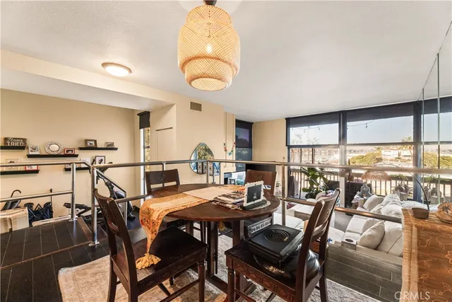 a view of a dining room with furniture window and outside view