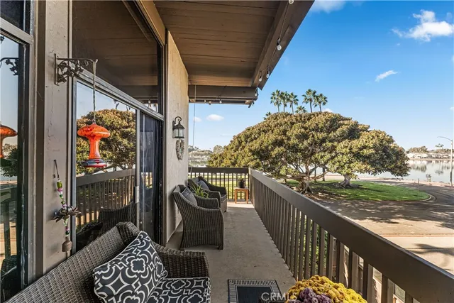 a view of balcony with wooden floor