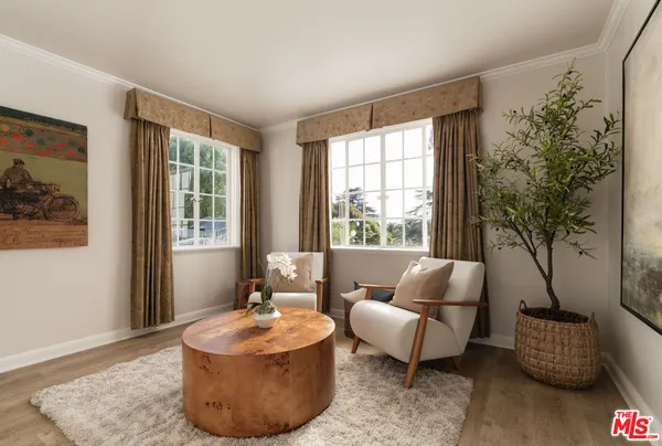 a bedroom with a bed lamps and window