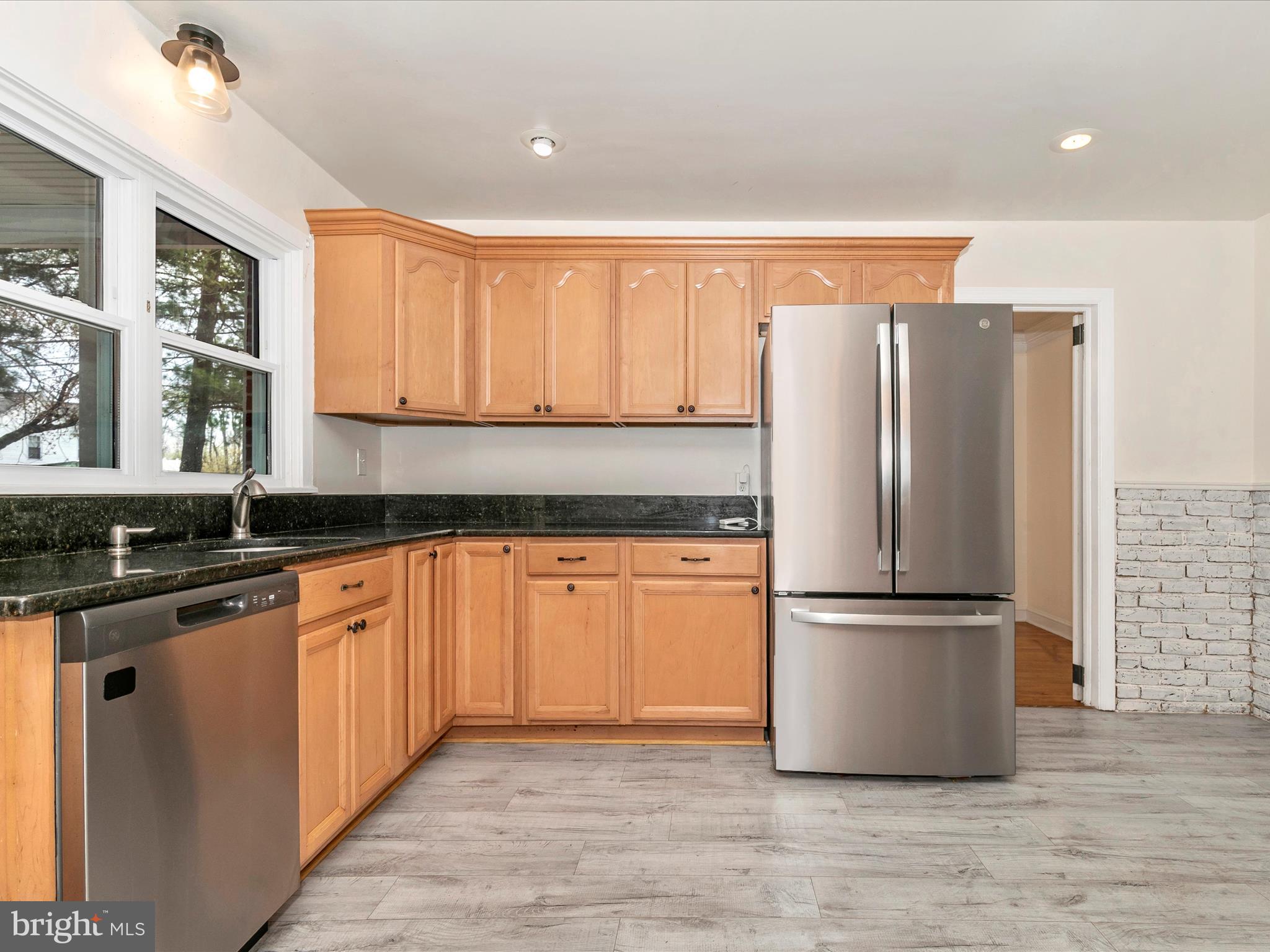 8913 Yellow Springs Road Frederick, MD 21702 - Photo 15 of 77 a kitchen with stainless steel appliances granite countertop a refrigerator and a sink