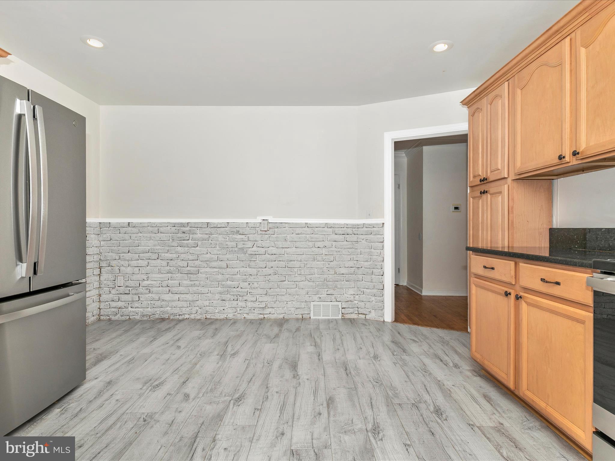8913 Yellow Springs Road Frederick, MD 21702 - Photo 19 of 77 a view of kitchen with wooden floor and electronic appliances