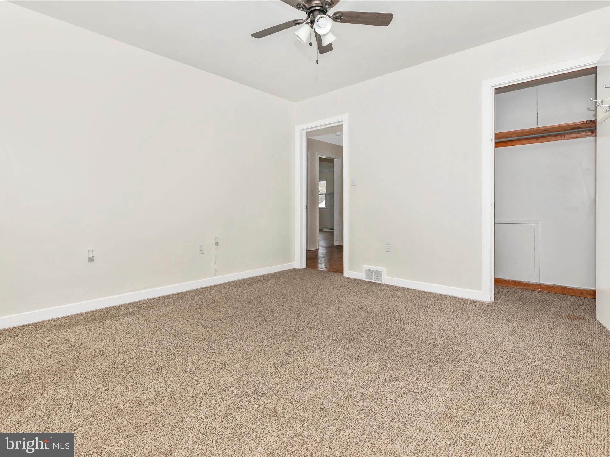 8913 Yellow Springs Road Frederick, MD 21702 - Photo 28 of 77 an empty room with a ceiling fan and a window