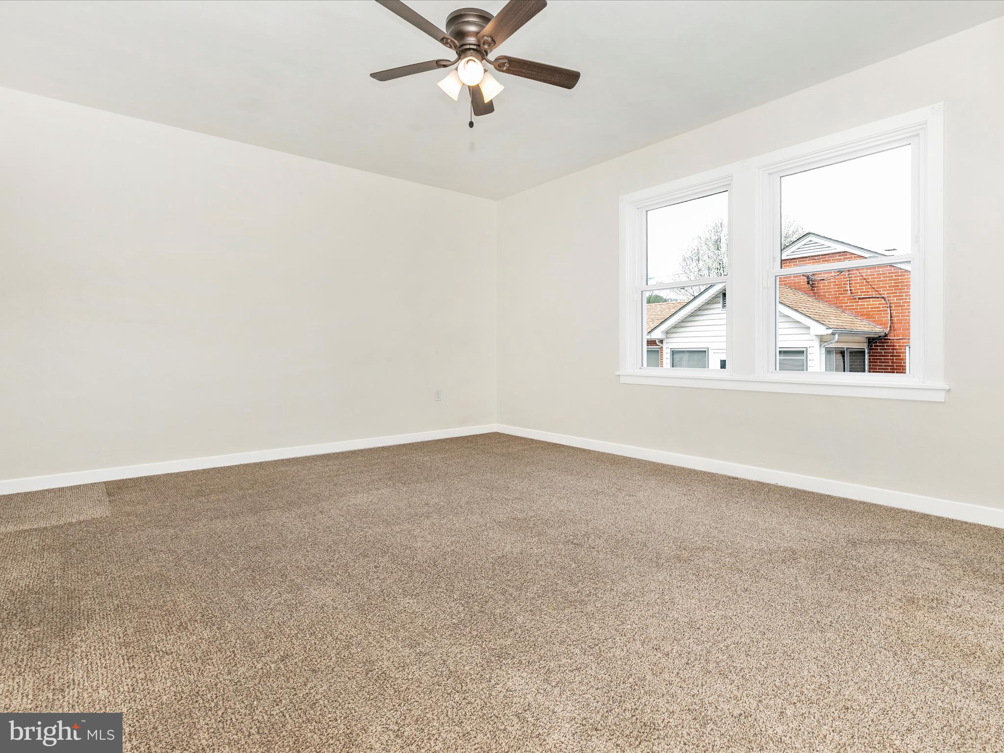 8913 Yellow Springs Road Frederick, MD 21702 - Photo 30 of 77 an empty room with windows and fan
