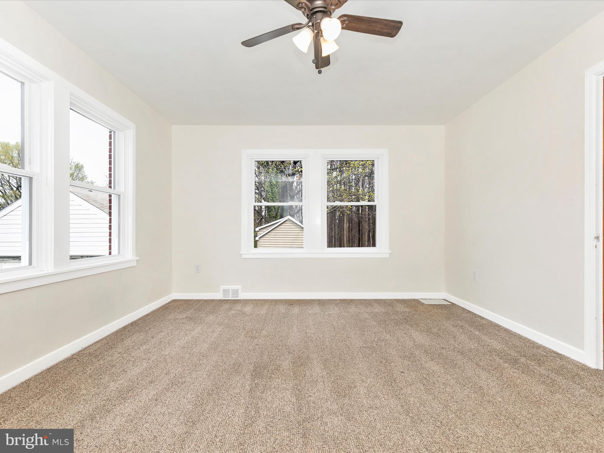 8913 Yellow Springs Road Frederick, MD 21702 - Photo 32 of 77 an empty room with window and ceiling fan