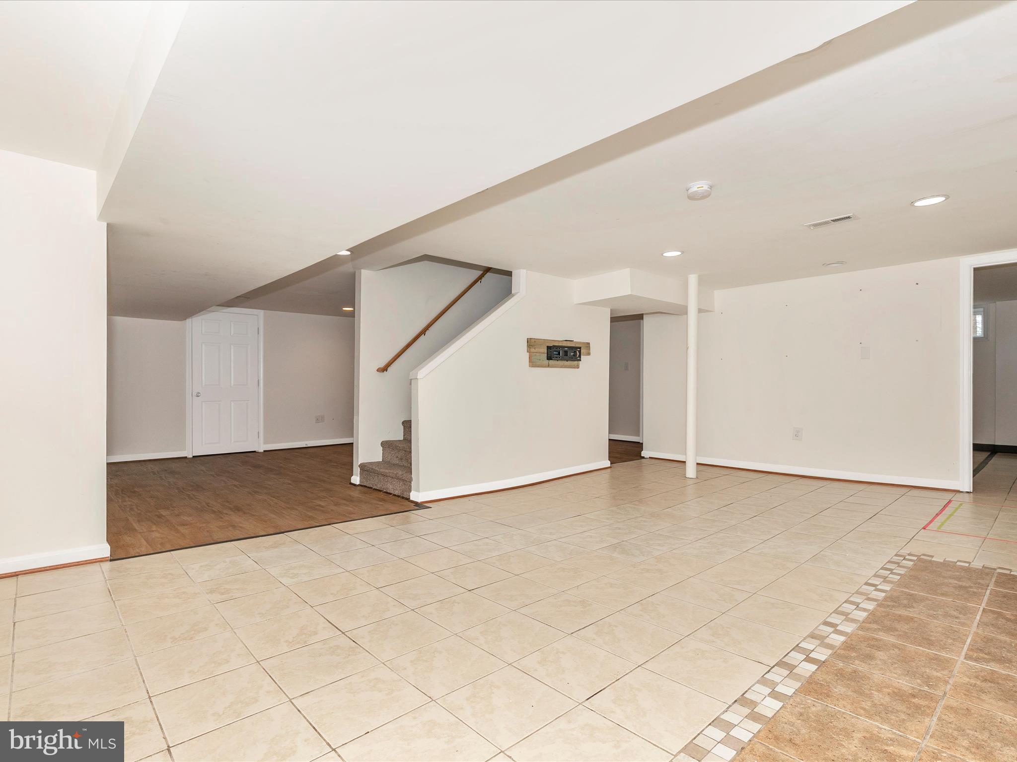 8913 Yellow Springs Road Frederick, MD 21702 - Photo 40 of 77 a view of an empty room with wooden floor