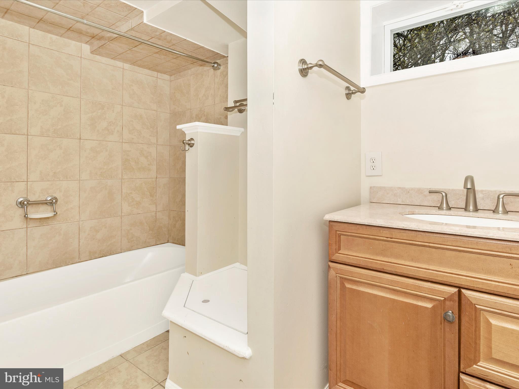 8913 Yellow Springs Road Frederick, MD 21702 - Photo 47 of 77 a bathroom with a shower a bath tub and a sink