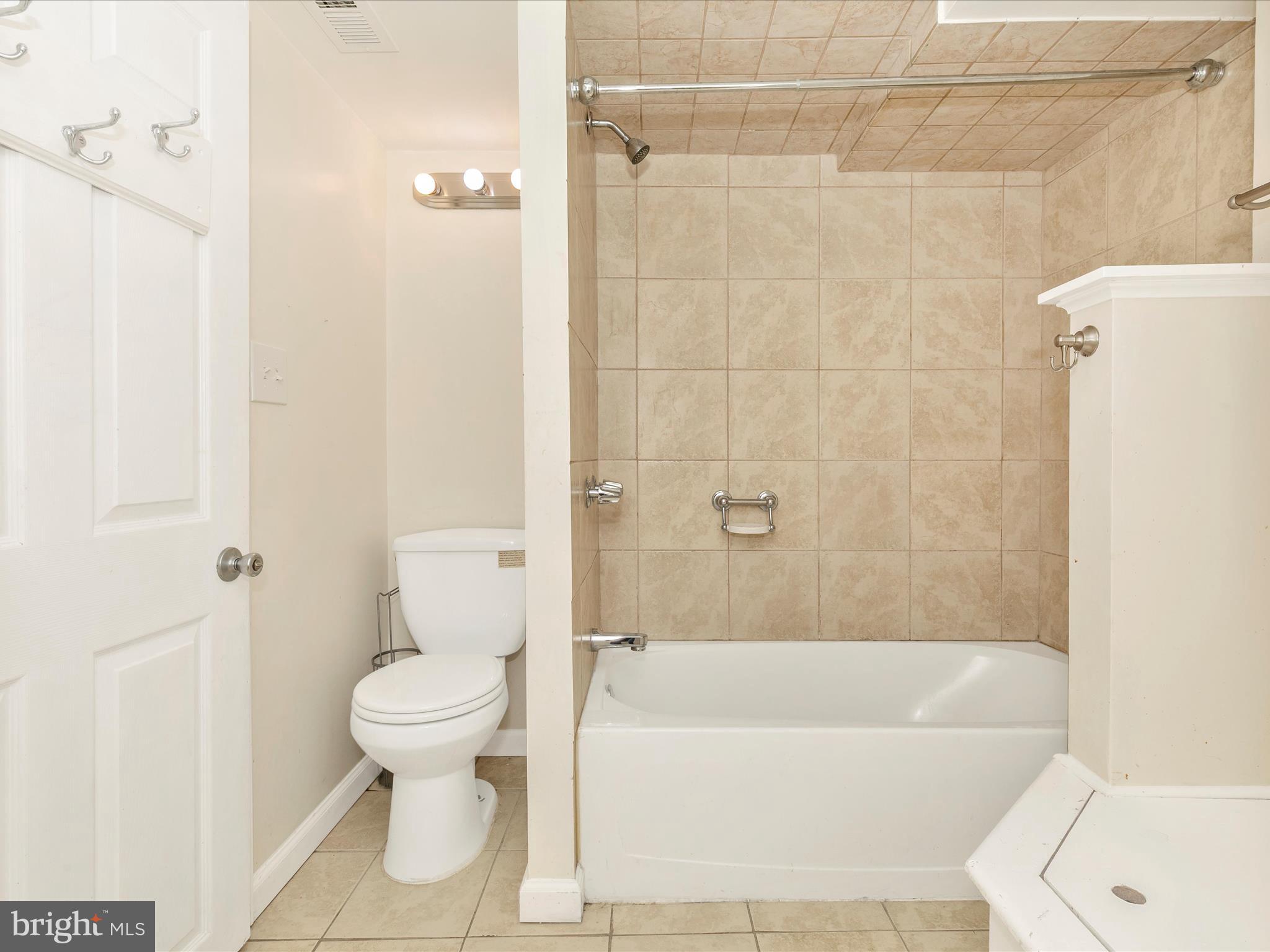 8913 Yellow Springs Road Frederick, MD 21702 - Photo 49 of 77 a bathroom with a toilet and a bathtub