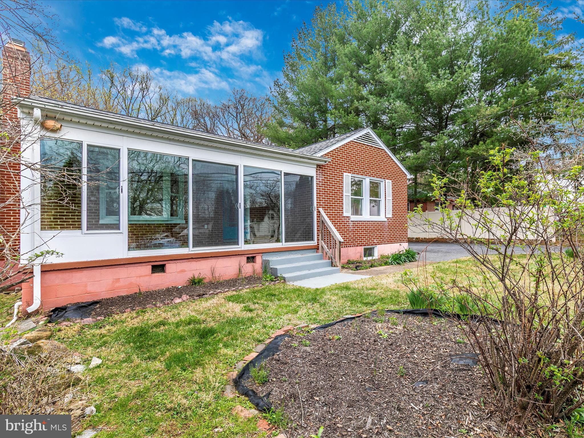 8913 Yellow Springs Road Frederick, MD 21702 - Photo 60 of 77 a view of a house with a backyard and a large tree
