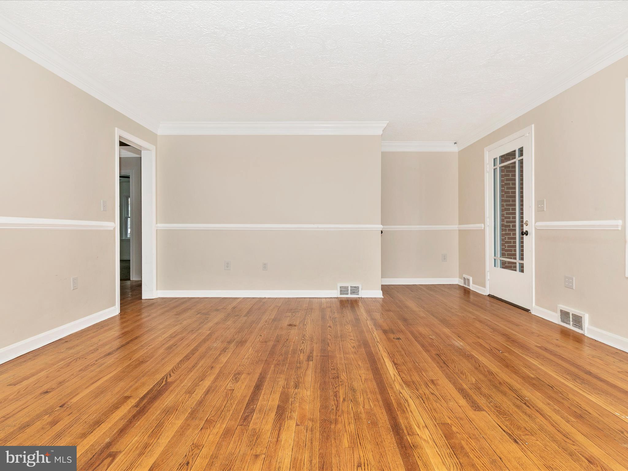 8913 Yellow Springs Road Frederick, MD 21702 - Photo 6 of 77 an empty room with wooden floor and windows