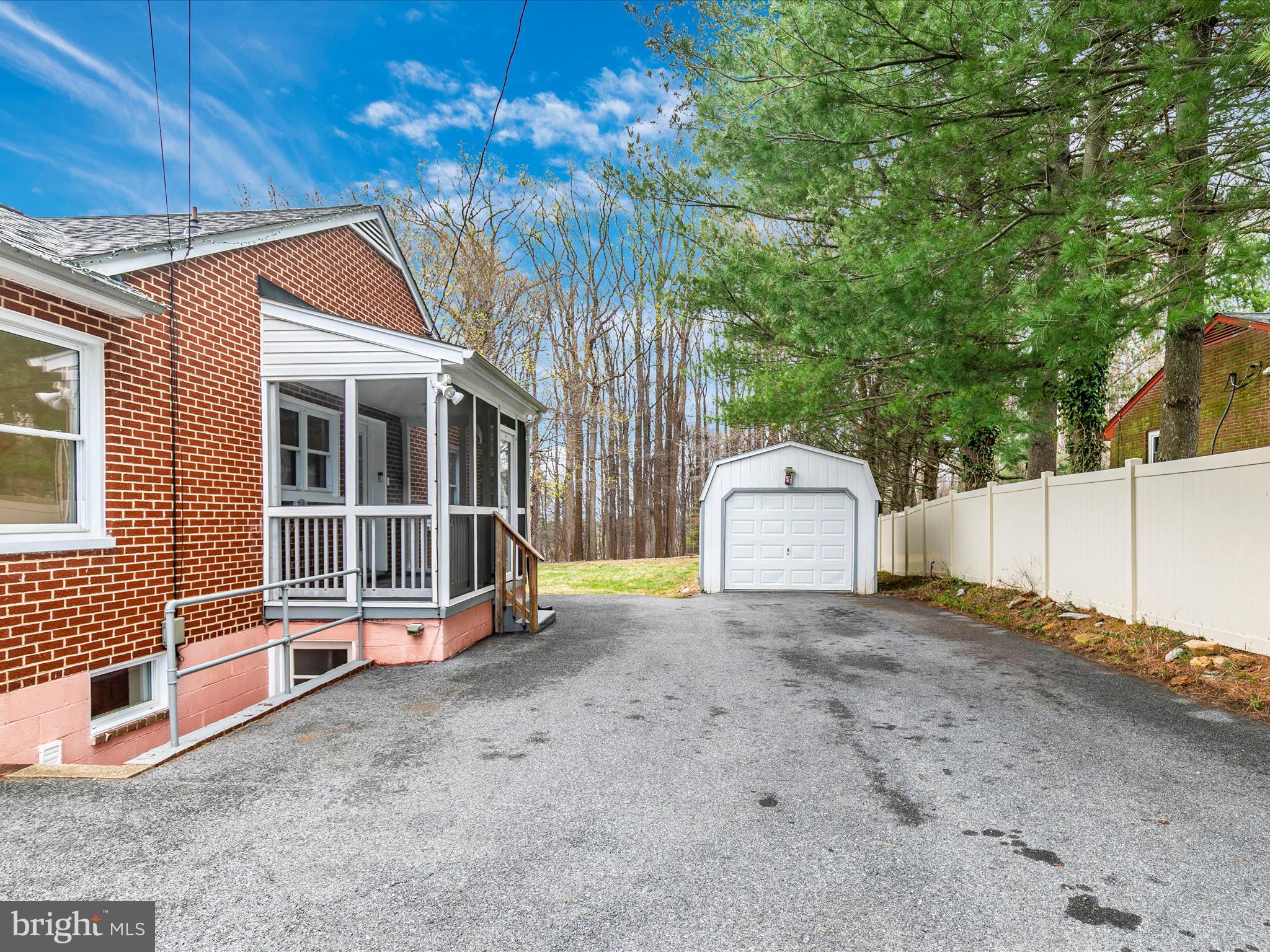 8913 Yellow Springs Road Frederick, MD 21702 - Photo 65 of 77 a view of a house with a yard and wooden fence