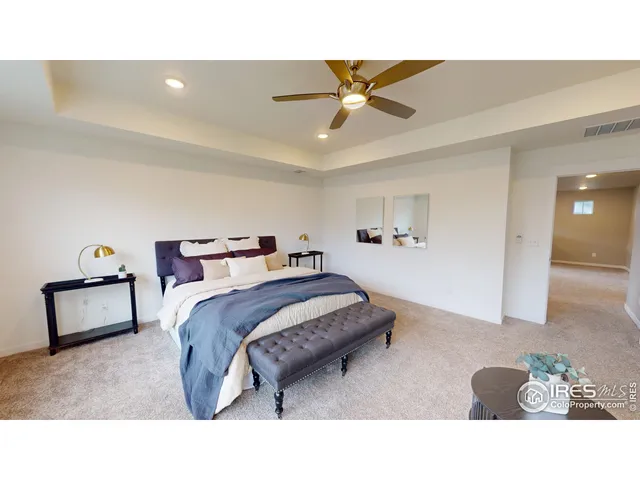 a living room with a bed and furniture